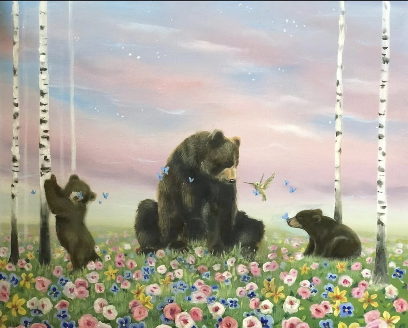 Bärenfamilie im Blumenfeld